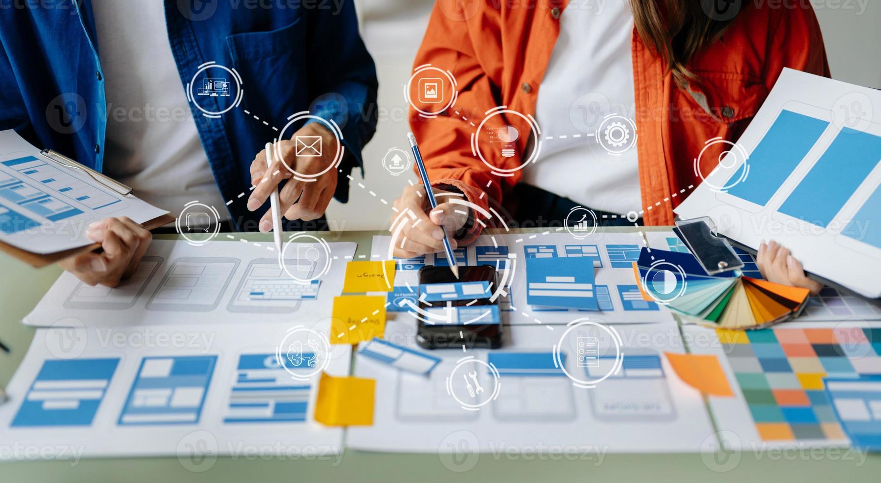 Asian businessman and woman people meeting in office. Employee brainstorm and work as team, plan and discuss project by point on paper and tablet. photo