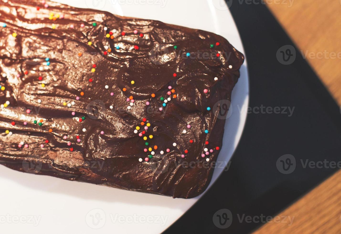 a homemade chocolate cake on a plate photo