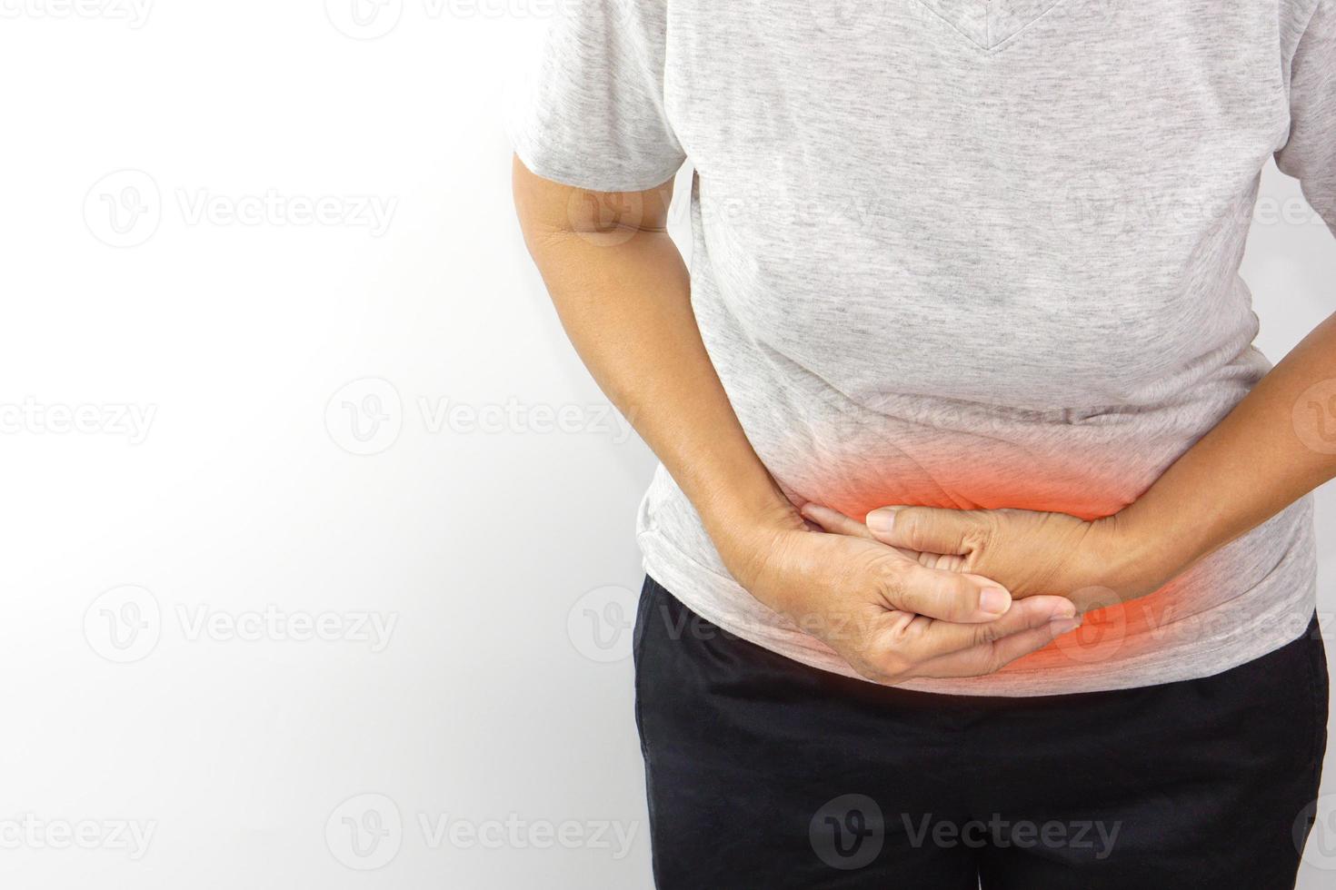 Asian woman suffering from stomachache. Chronic gastritis, menstruation and health concept. photo