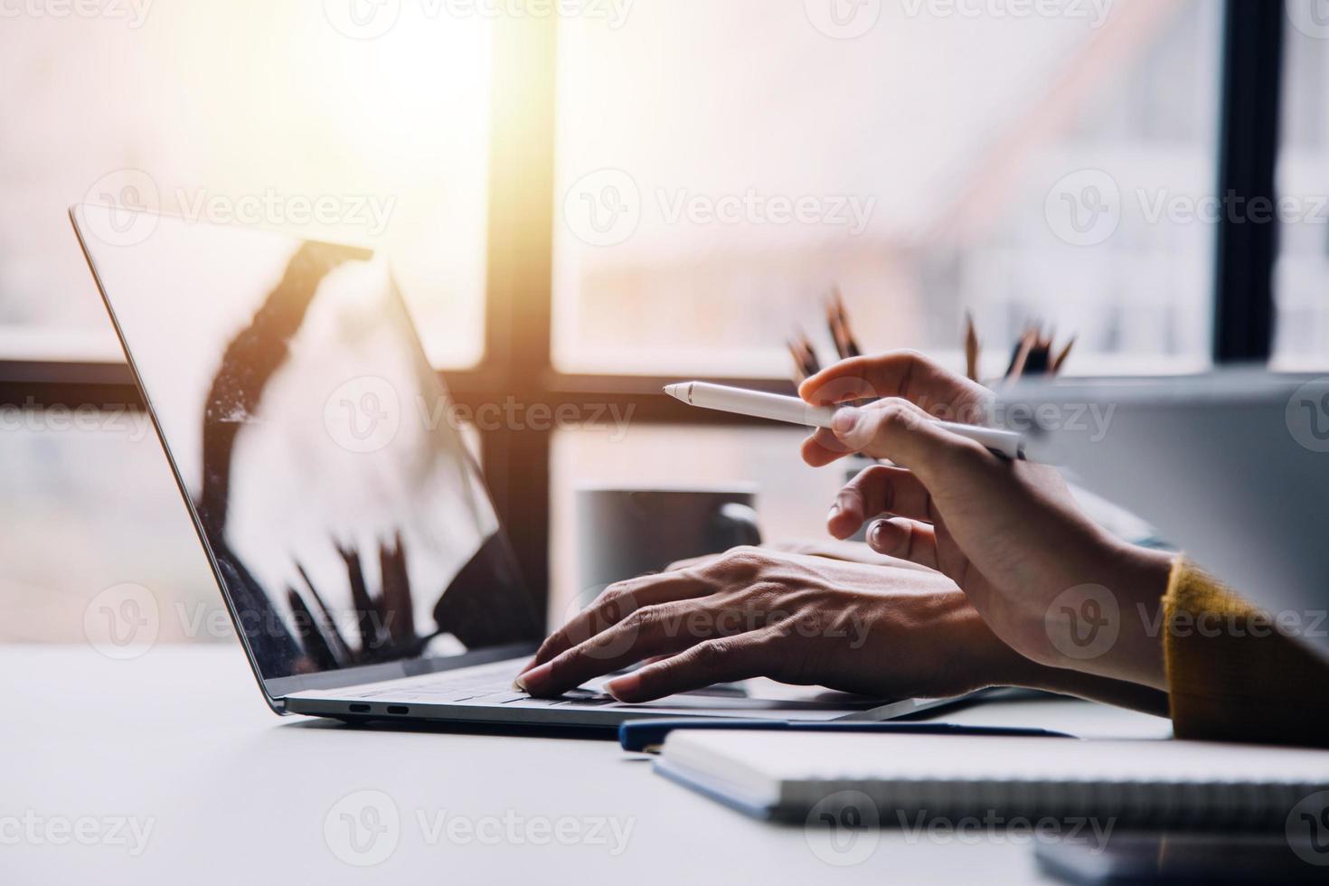 Group of confident business people point to graphs and charts to analyze market data, balance sheet, account, net profit to plan new sales strategies to increase production capacity. photo