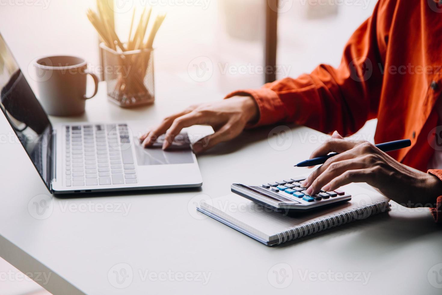 Group of confident business people point to graphs and charts to analyze market data, balance sheet, account, net profit to plan new sales strategies to increase production capacity. photo