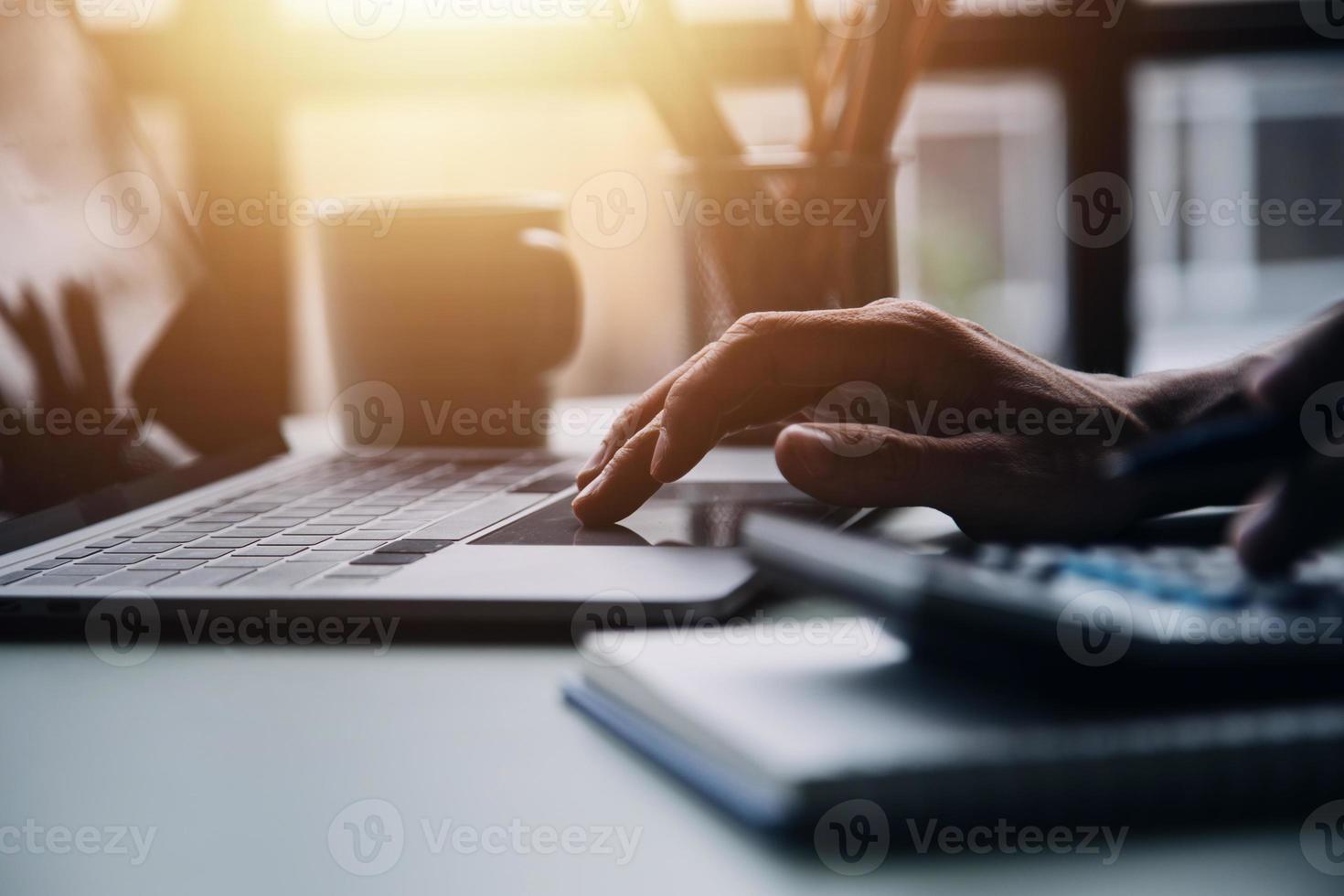 Group of confident business people point to graphs and charts to analyze market data, balance sheet, account, net profit to plan new sales strategies to increase production capacity. photo