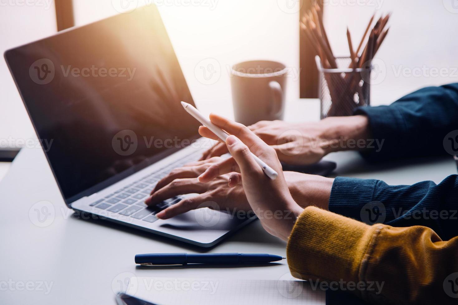 Group of confident business people point to graphs and charts to analyze market data, balance sheet, account, net profit to plan new sales strategies to increase production capacity. photo