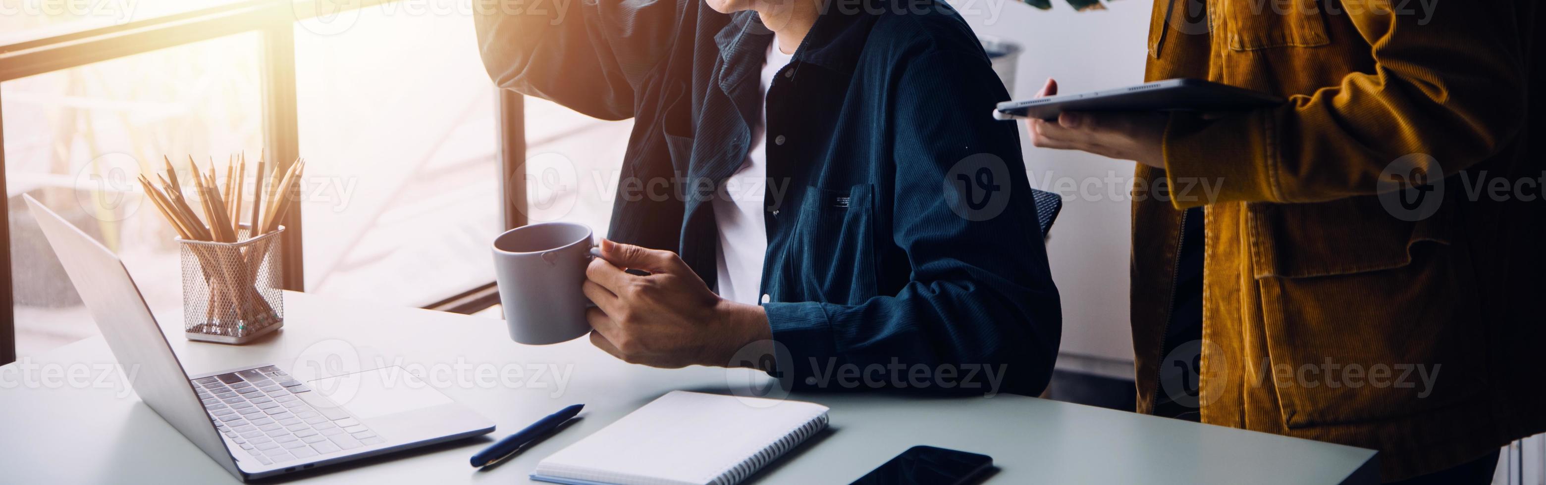 Group of confident business people point to graphs and charts to analyze market data, balance sheet, account, net profit to plan new sales strategies to increase production capacity. photo