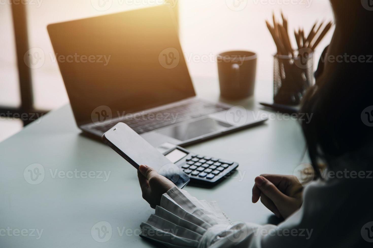 Group of confident business people point to graphs and charts to analyze market data, balance sheet, account, net profit to plan new sales strategies to increase production capacity. photo