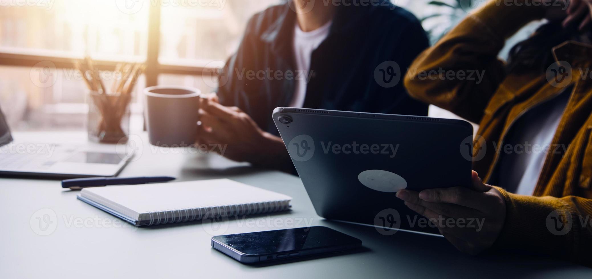 Group of confident business people point to graphs and charts to analyze market data, balance sheet, account, net profit to plan new sales strategies to increase production capacity. photo