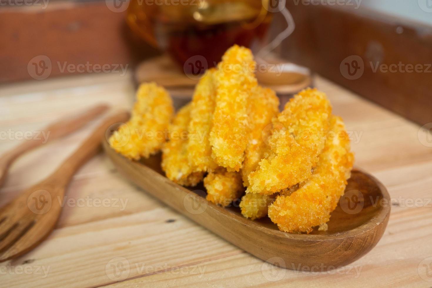 selective focus on banana nuggets coated with flour panir or breadcrumbs. soft focus photo