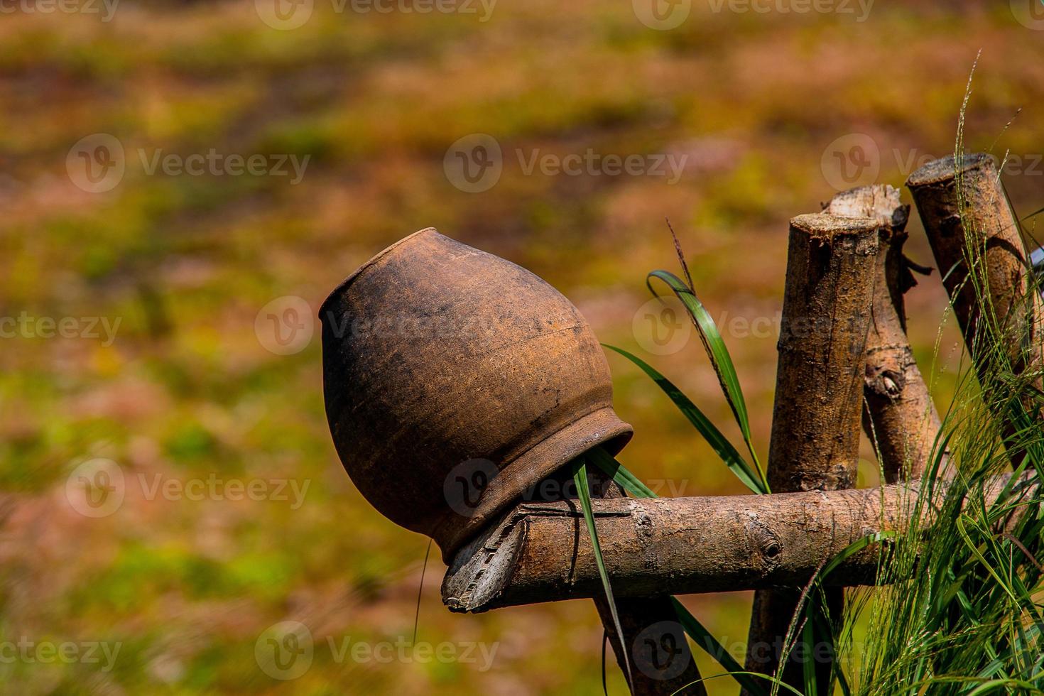 clay pots on the fence decoration Polish village open-air museum on a summer day photo