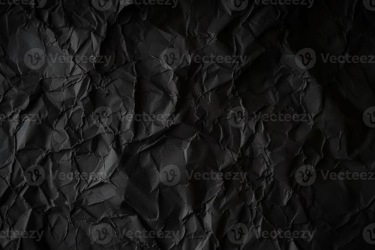 Design space black and dark crumpled paper textured background. photo