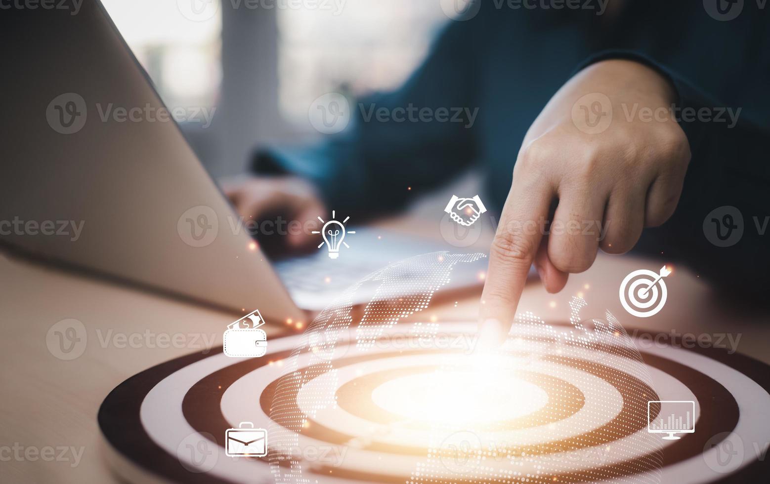 Targeting with marketing business concept, Businesswoman hand touch dart to the virtual target dartboard, Executive marketing, investment goal and target for business investment concept, photo