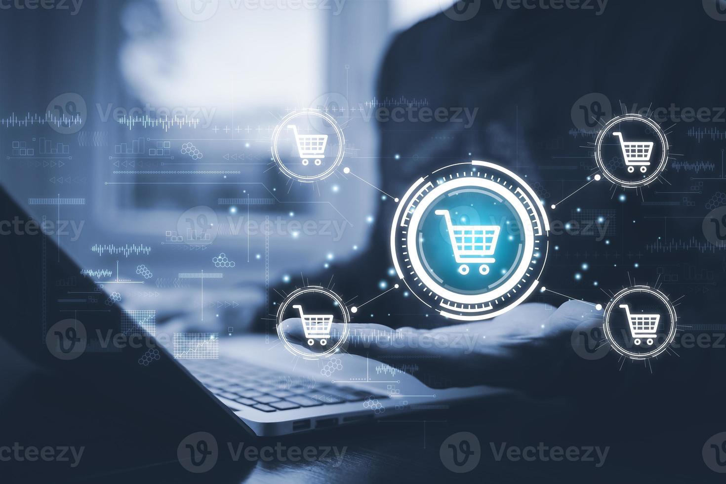 Businessmen using a laptop with online shopping concept, marketplace website with virtual interface of online Shopping cart part of the network, Online shopping business with selecting shopping cart. photo