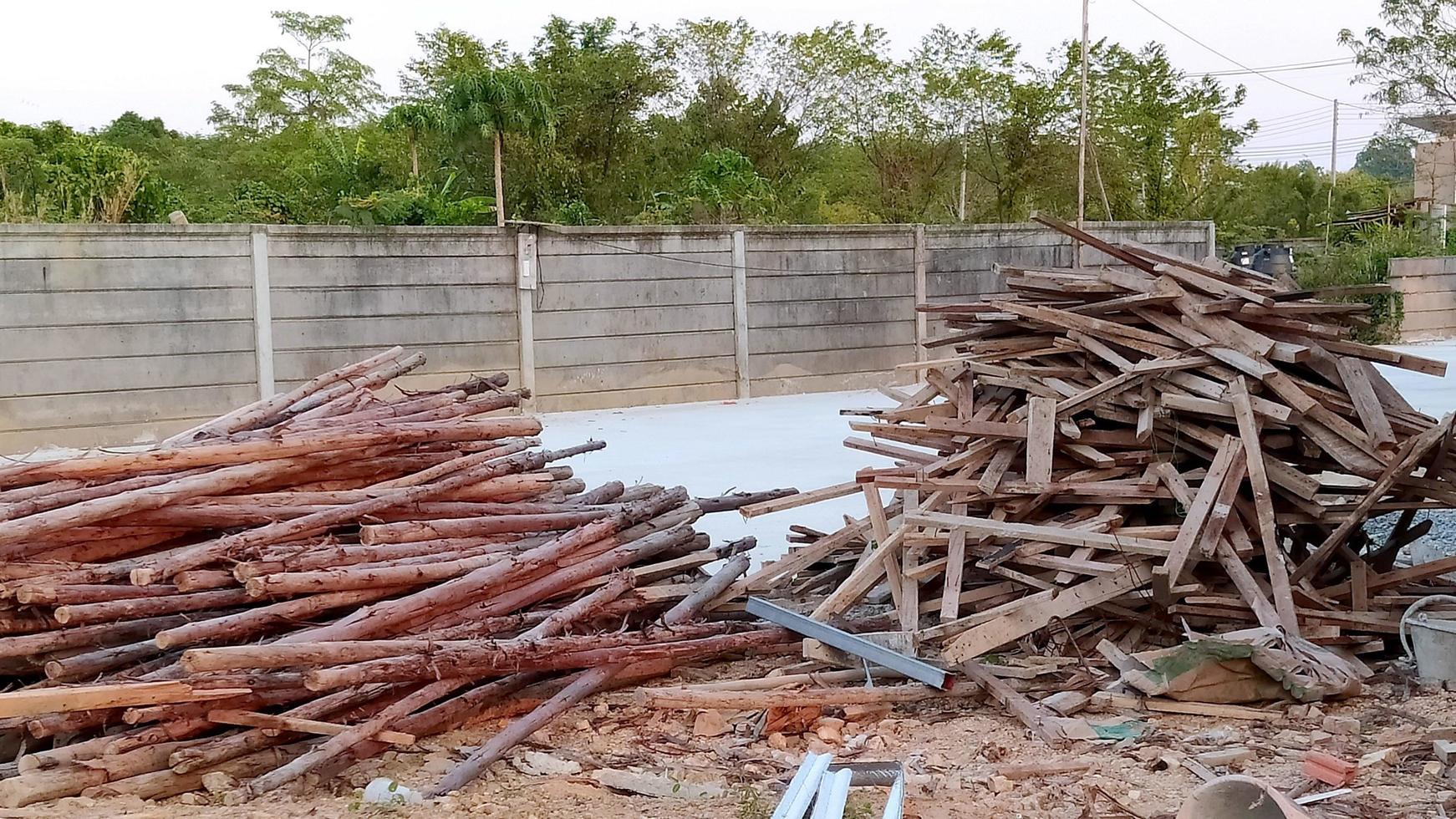 Shot of two piles of wood at a construction site. photo