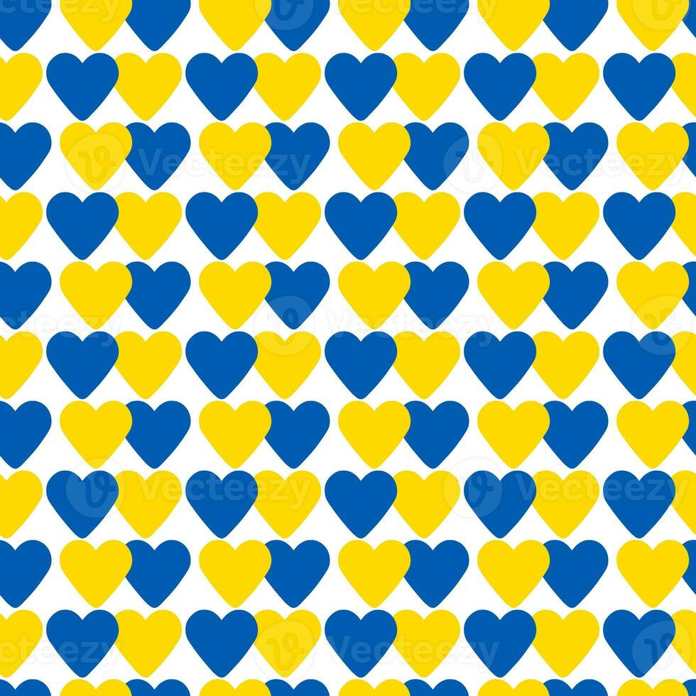 abstract seamless pattern made of blue and yellow hearts photo