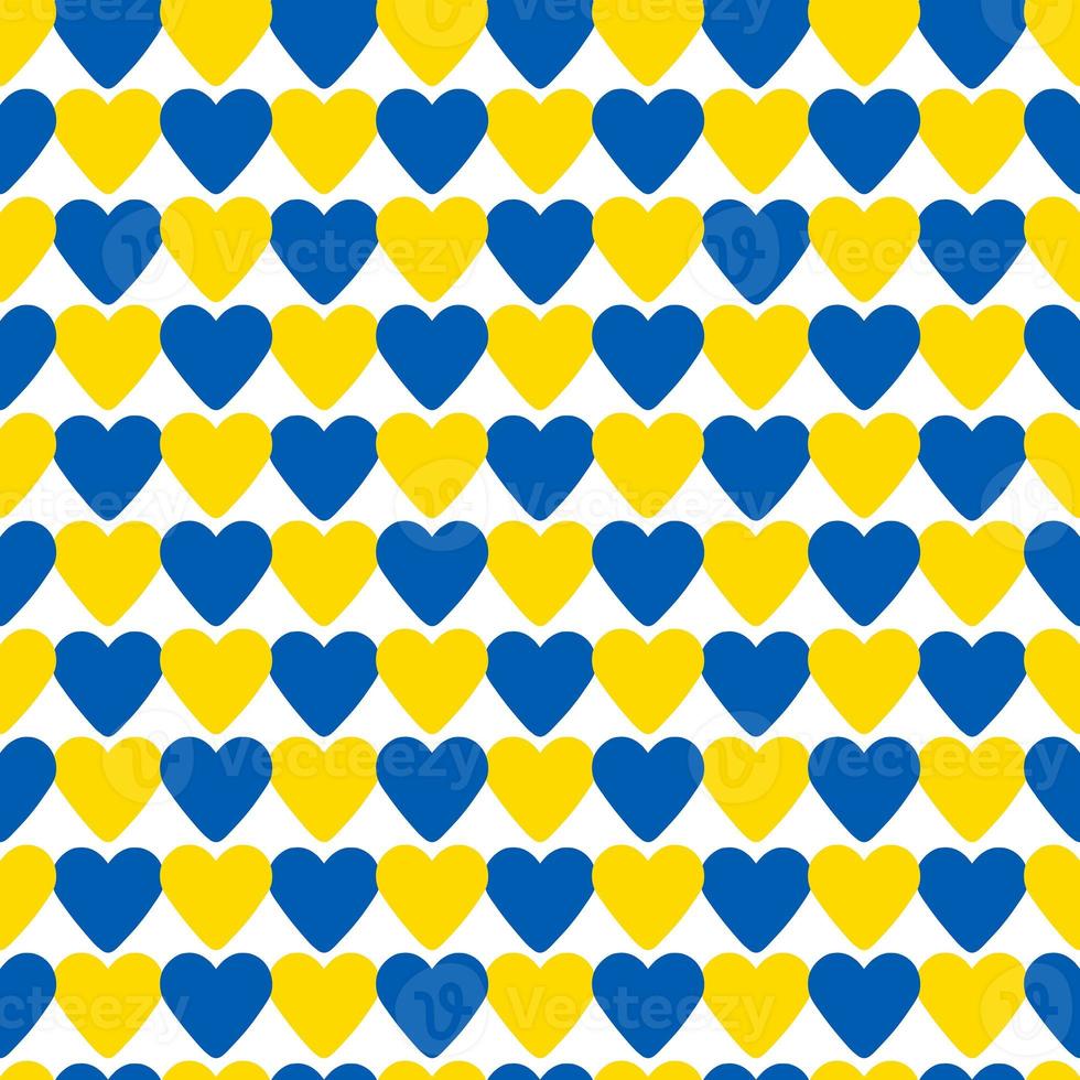 abstract seamless pattern made of blue and yellow hearts photo