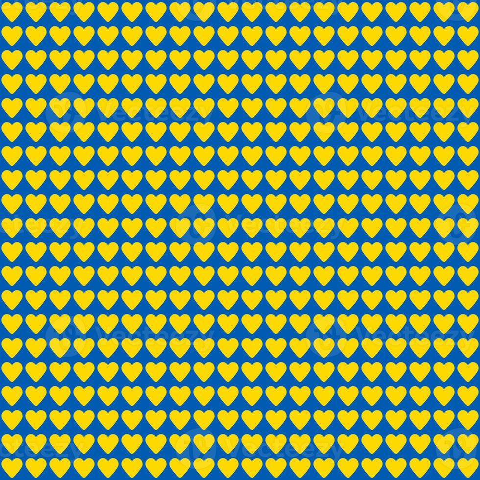 seamless pattern made of yellow hearts on blue background photo