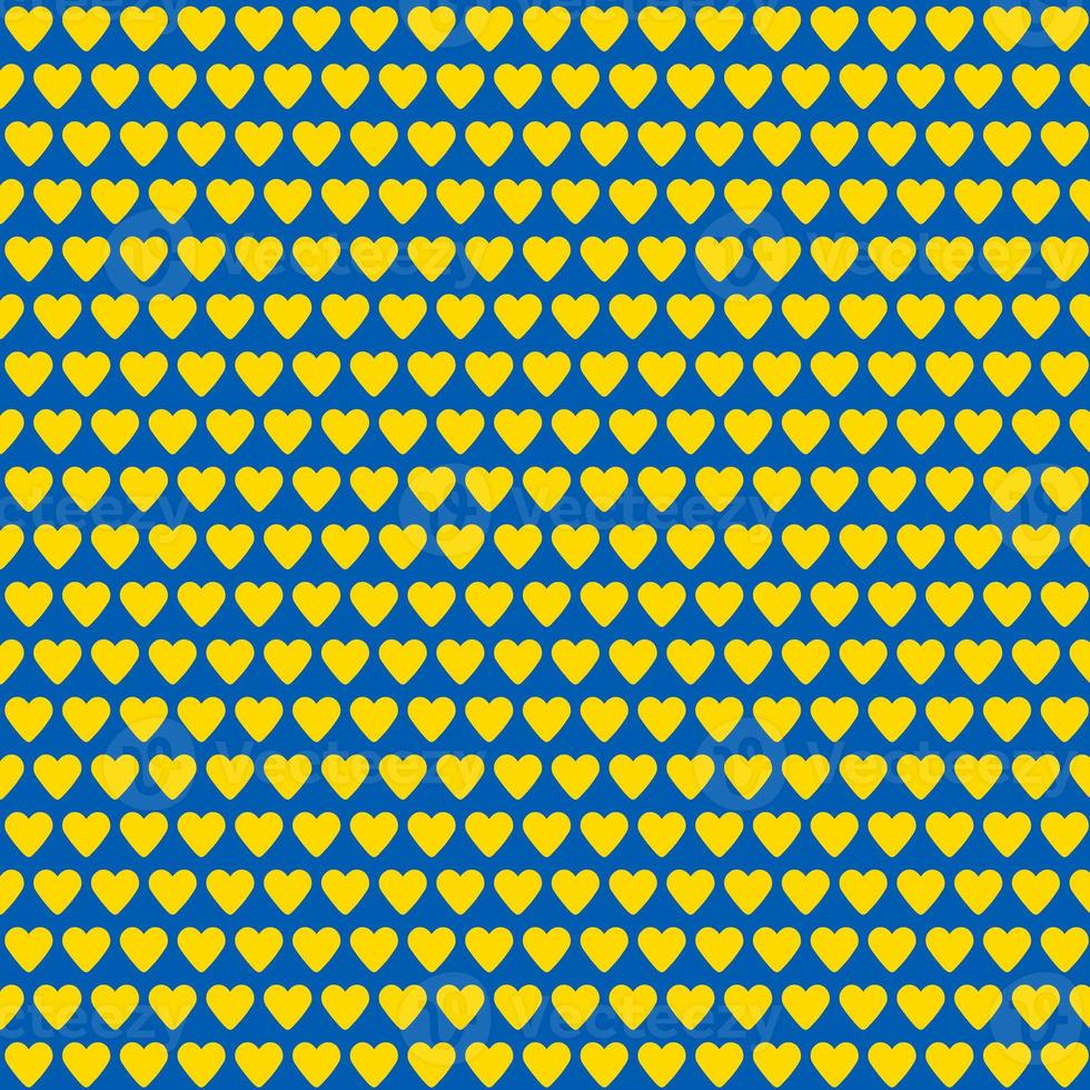 seamless pattern made of yellow hearts on blue background photo