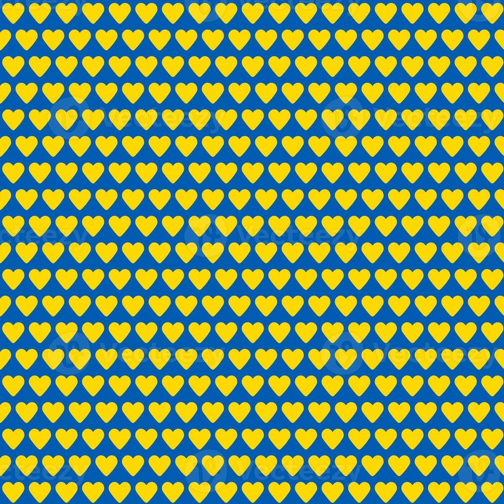 seamless pattern made of yellow hearts on blue background photo