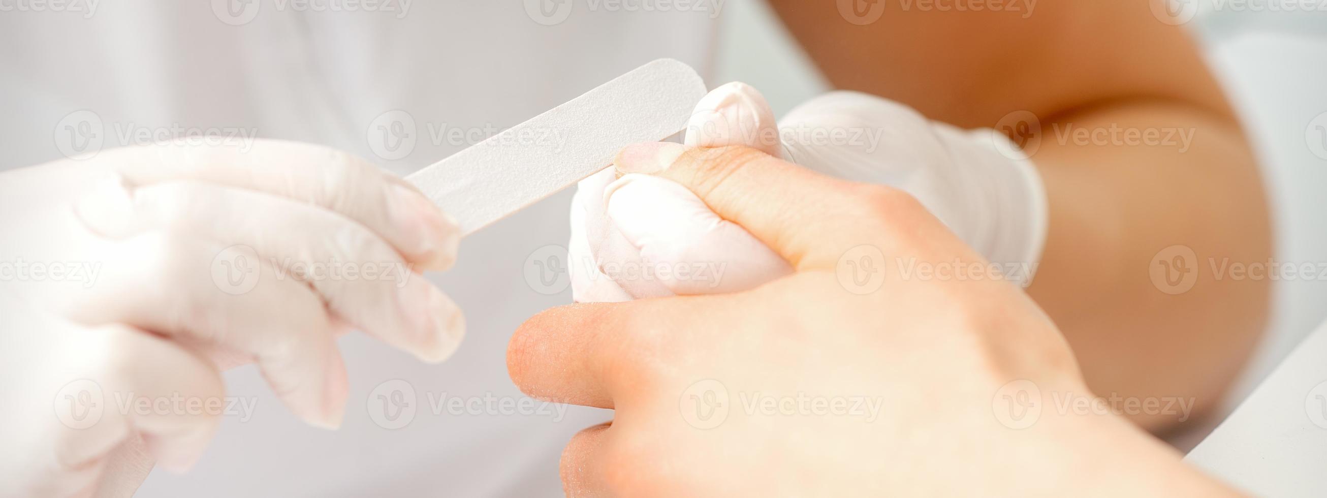 Hand receiving the nail file photo