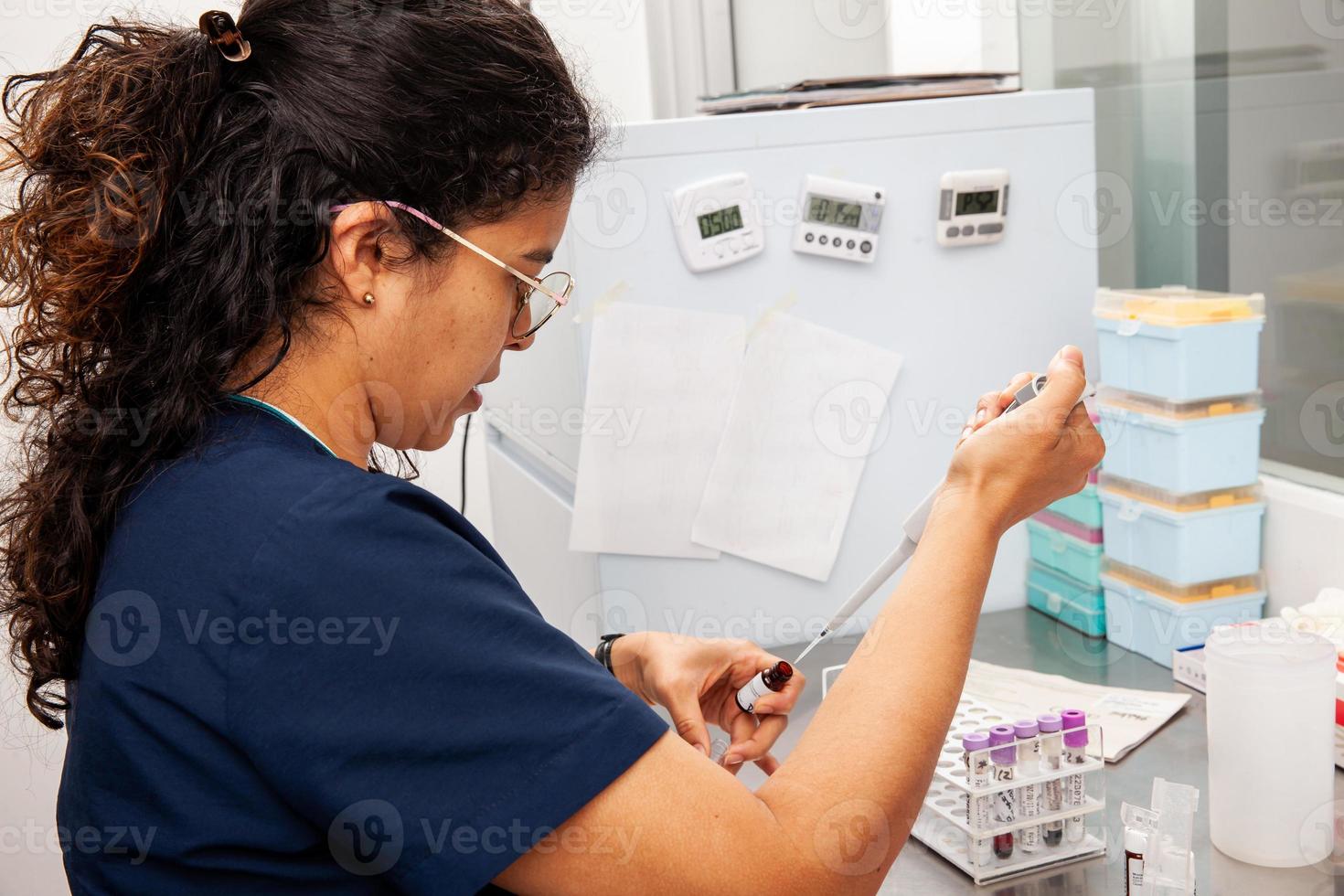 Scientist preparing samples for flow cytometric analysis using a monoclonal antibody. photo