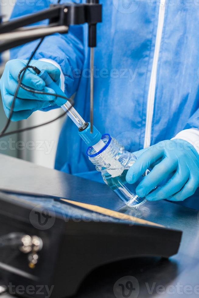 Scientist using a ph meter at laboratory photo