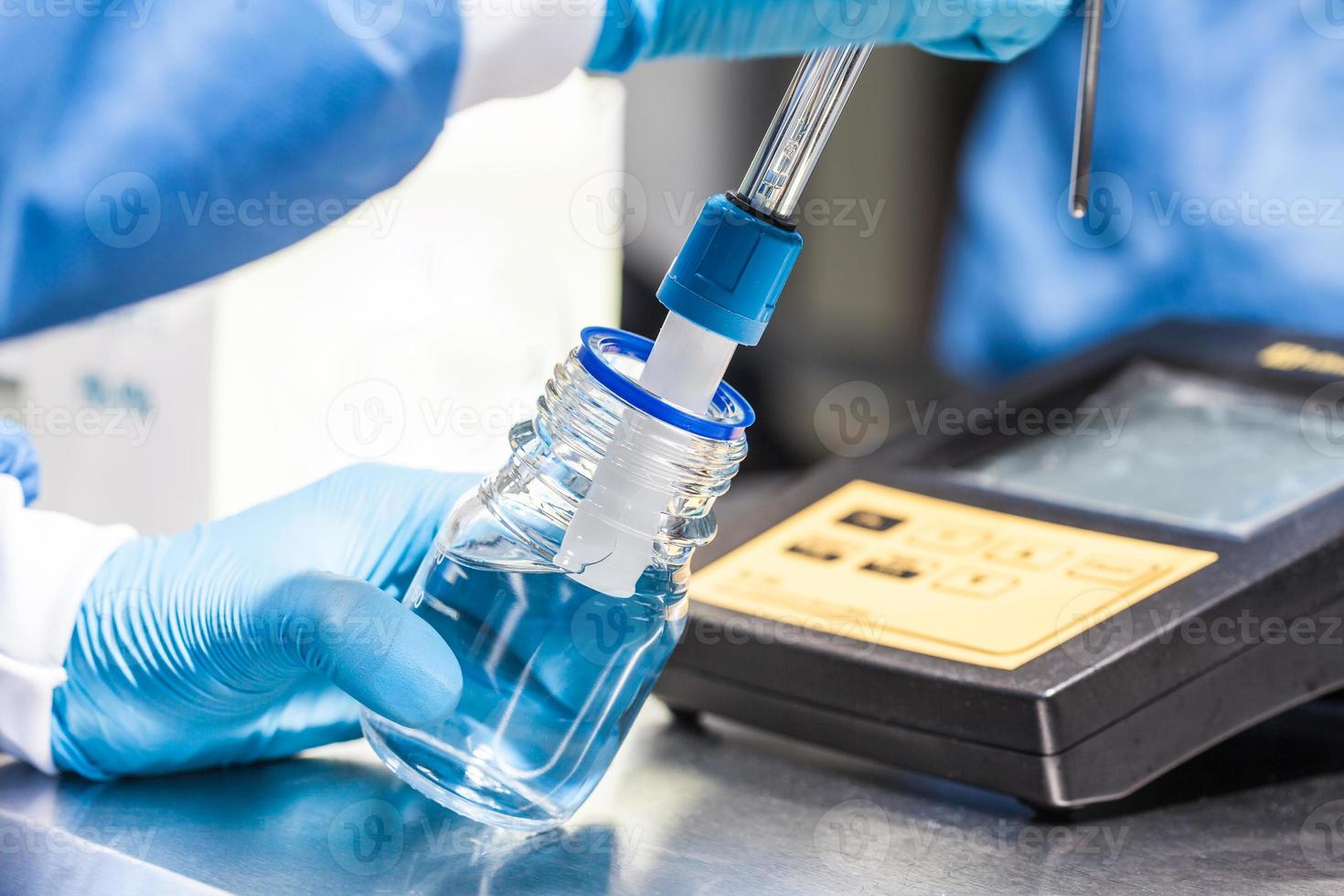 Scientist using a ph meter at laboratory photo