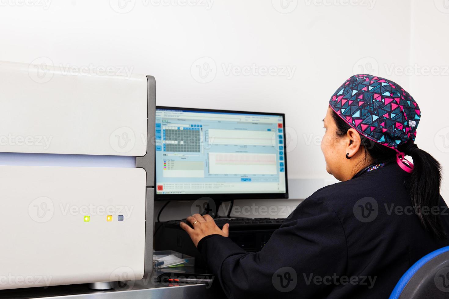 Female scientist working at the laboratory with a thermal cycler. Real-time polymerase chain reaction technique. RT-PCR technique photo