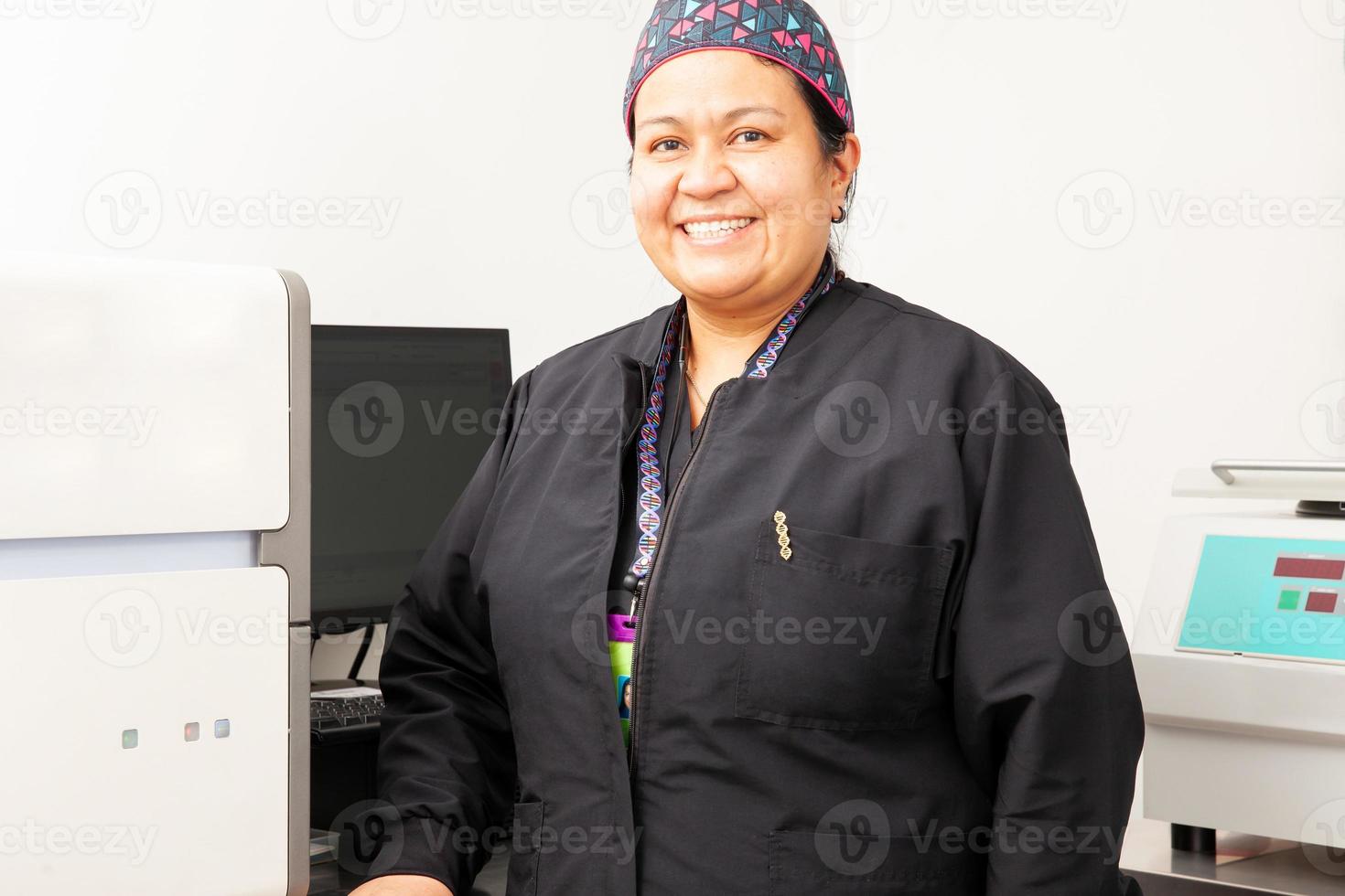 Female scientist working at the laboratory with a thermal cycler. Polymerase chain reaction technique. PCR technique photo