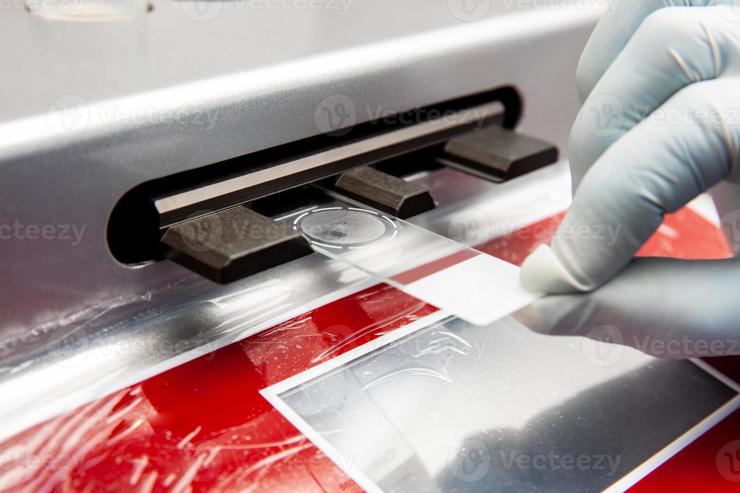 Scientist preparing microscope slides with liquid based cytology method for pap smear test. Cervical cancer concept. Medical concept. photo