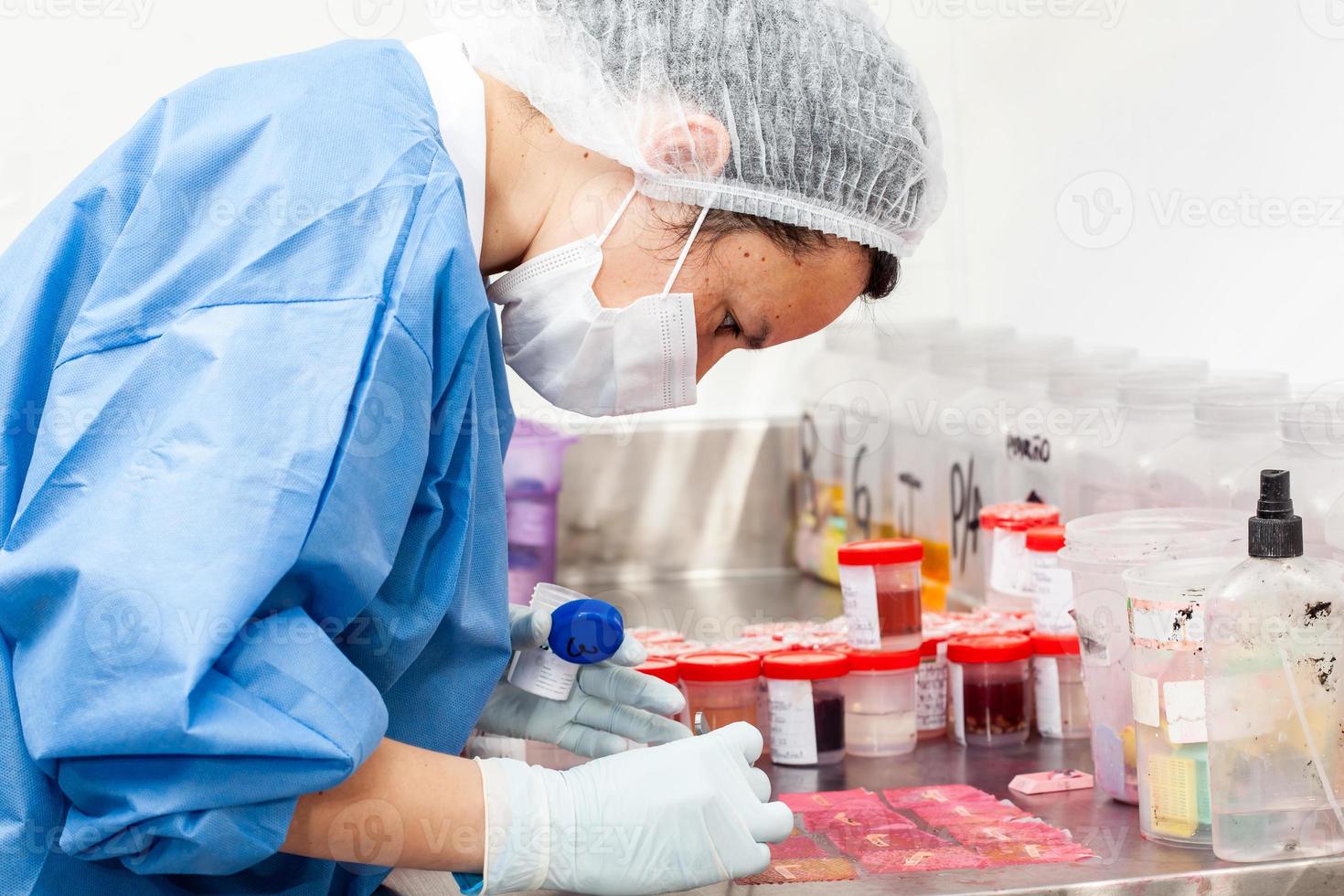 Scientist processing biopsy samples at the pathology laboratory to be embedded in paraffin for analysis. Cancer diagnosis concept. Medical concept. photo