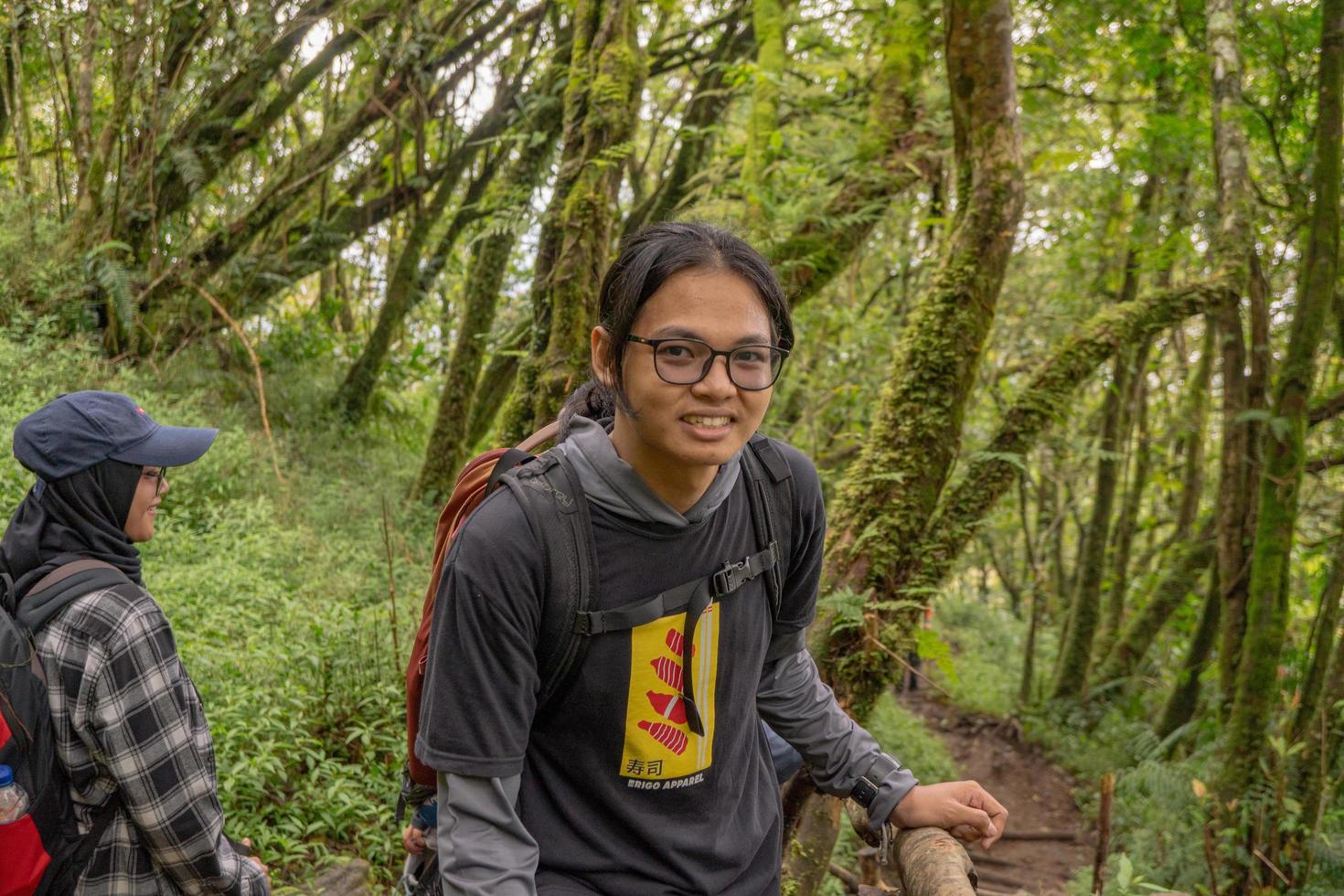 Man got journey on the forest going to peak mountain on Semarang Central Java. The photo is suitable to use for adventure content media, nature poster and forest background.