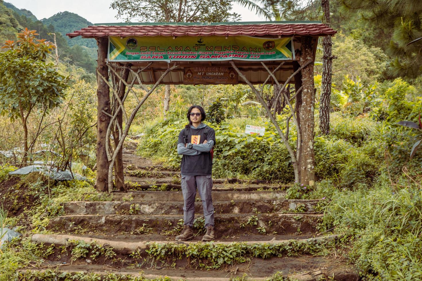 Man got journey on the forest going to peak mountain on Semarang Central Java. The photo is suitable to use for adventure content media, nature poster and forest background.