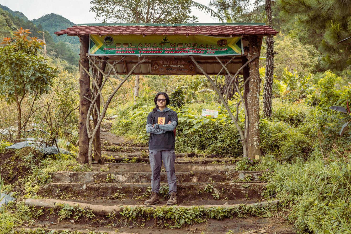 Man got journey on the forest going to peak mountain on Semarang Central Java. The photo is suitable to use for adventure content media, nature poster and forest background.