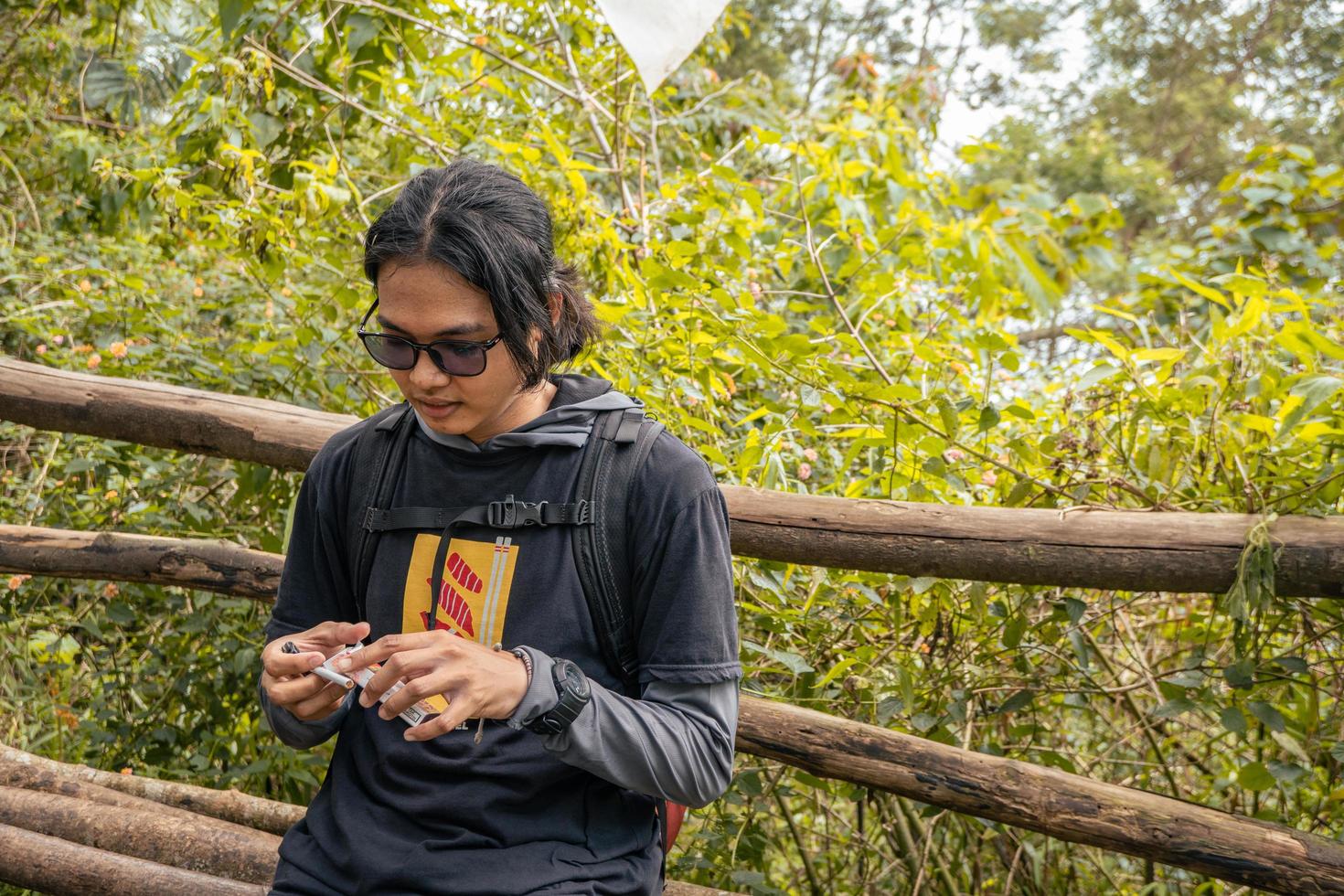 Man got journey on the forest going to peak mountain on Semarang Central Java. The photo is suitable to use for adventure content media, nature poster and forest background.