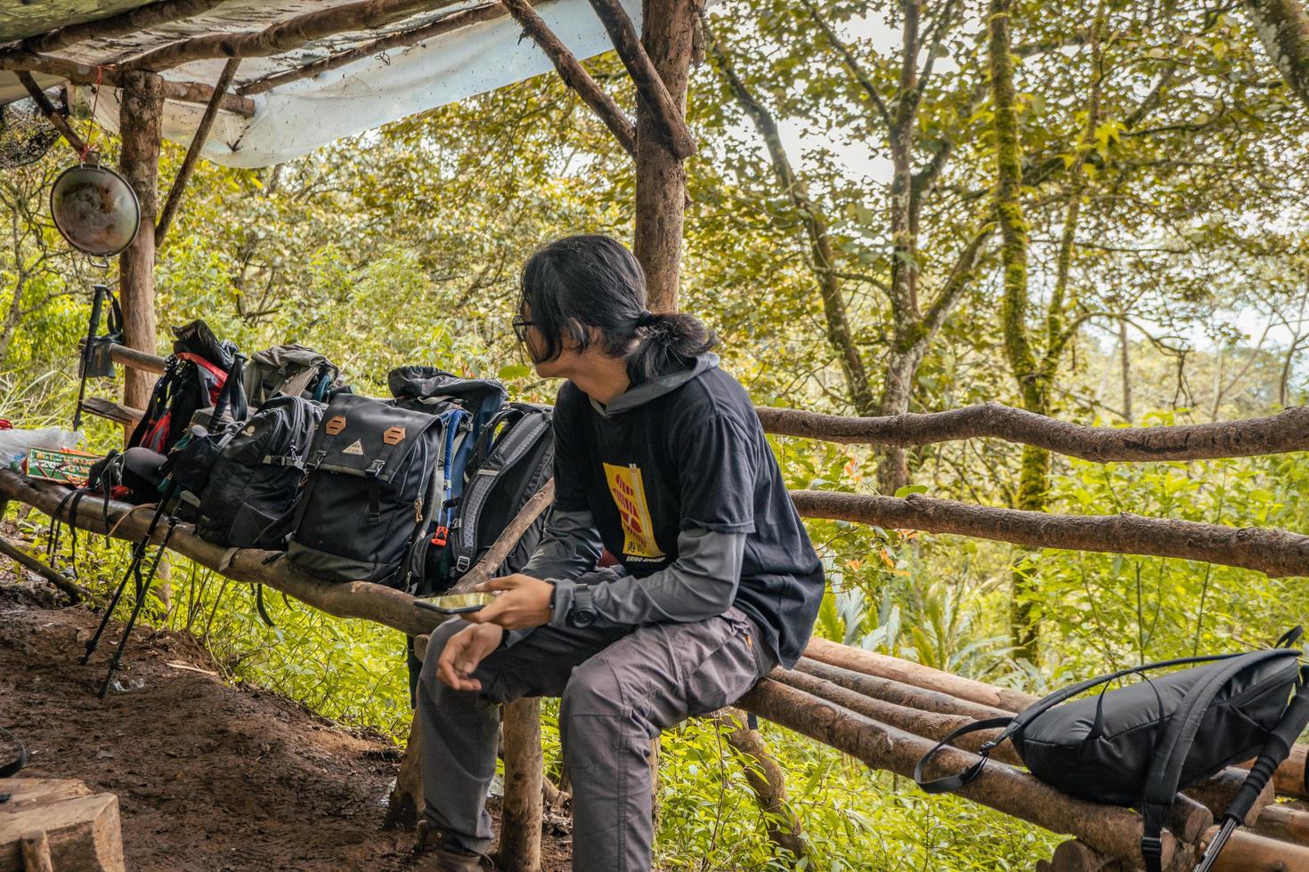 Man got journey on the forest going to peak mountain on Semarang Central Java. The photo is suitable to use for adventure content media, nature poster and forest background.