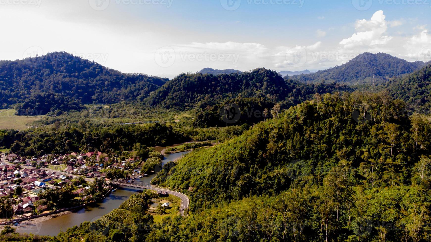 Aerial view of a village with hills and mountain in West Sumatra, Indonesia photo