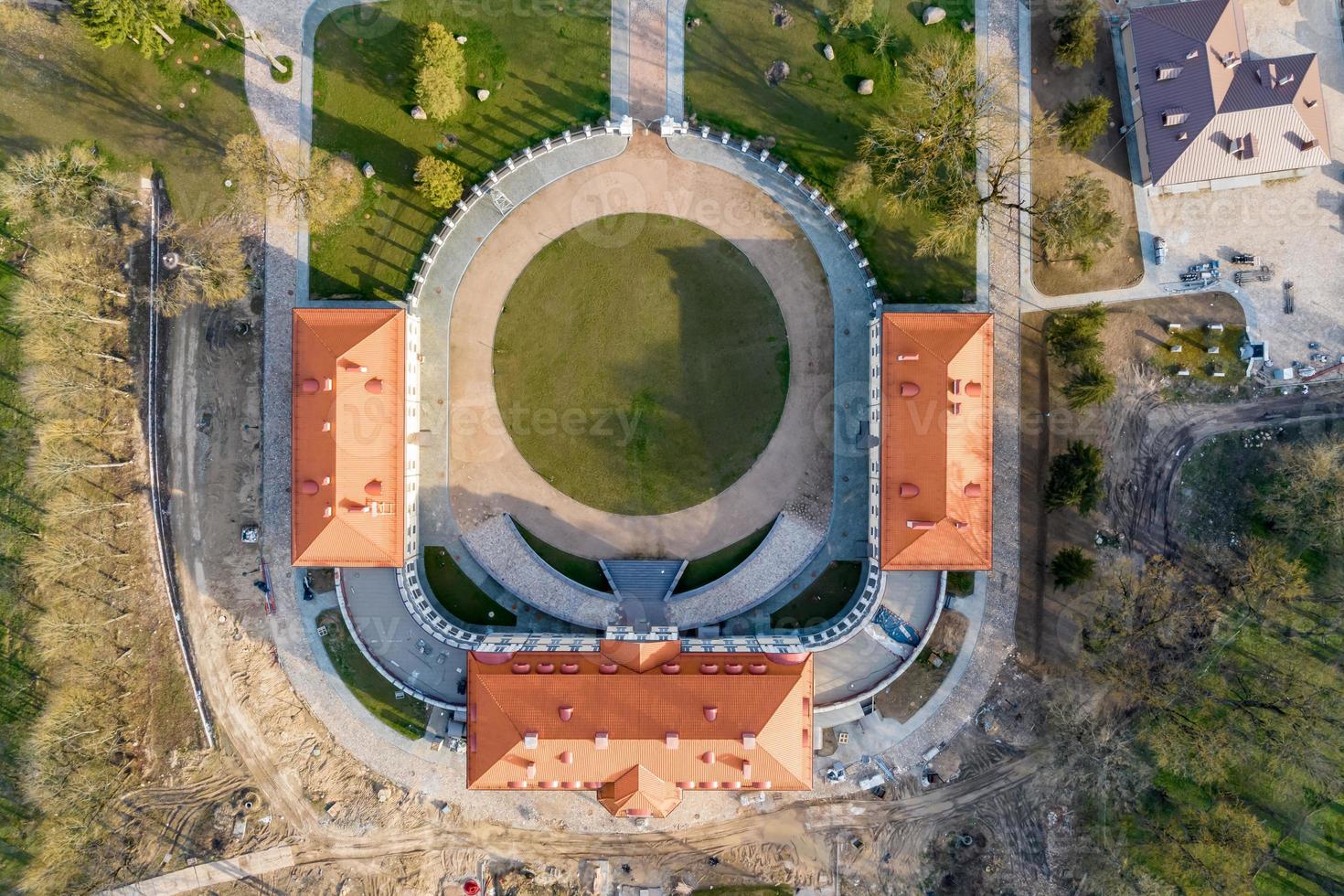 aerial view on overlooking restoration of the historic castle or palace near lake photo