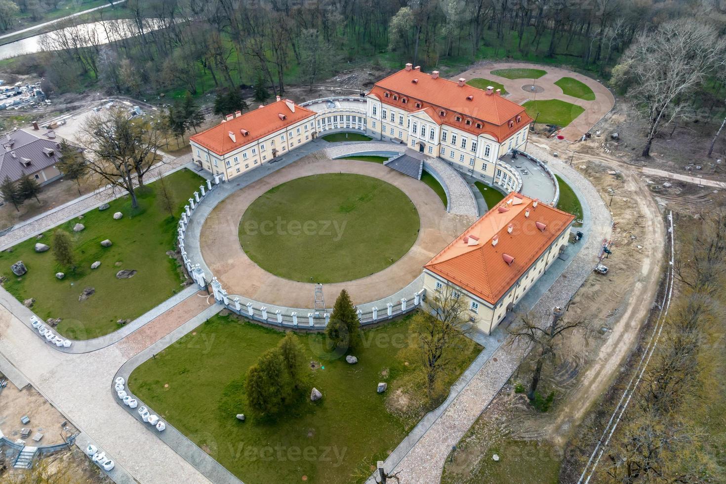 aerial view on overlooking restoration of the historic castle or palace near lake photo