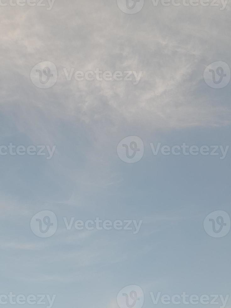 Beautiful white clouds on deep blue sky background. Large bright soft fluffy clouds are cover the entire blue sky. photo