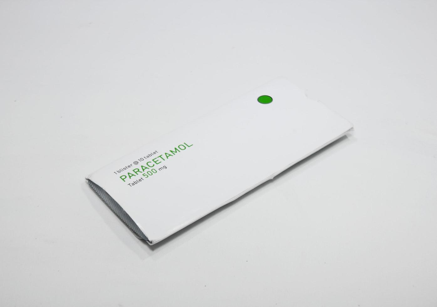 paper packaging box with the generic name of the drug Paracetamol 500 mg and blister with pills photo