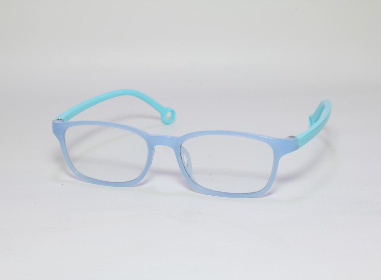 Blue square glasses on white background. Colorful eyeglasses. photo