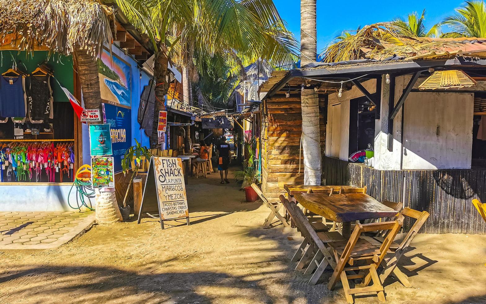 Puerto Escondido Oaxaca 2023 Colorful tourist street people stores restaurants bar La Punta