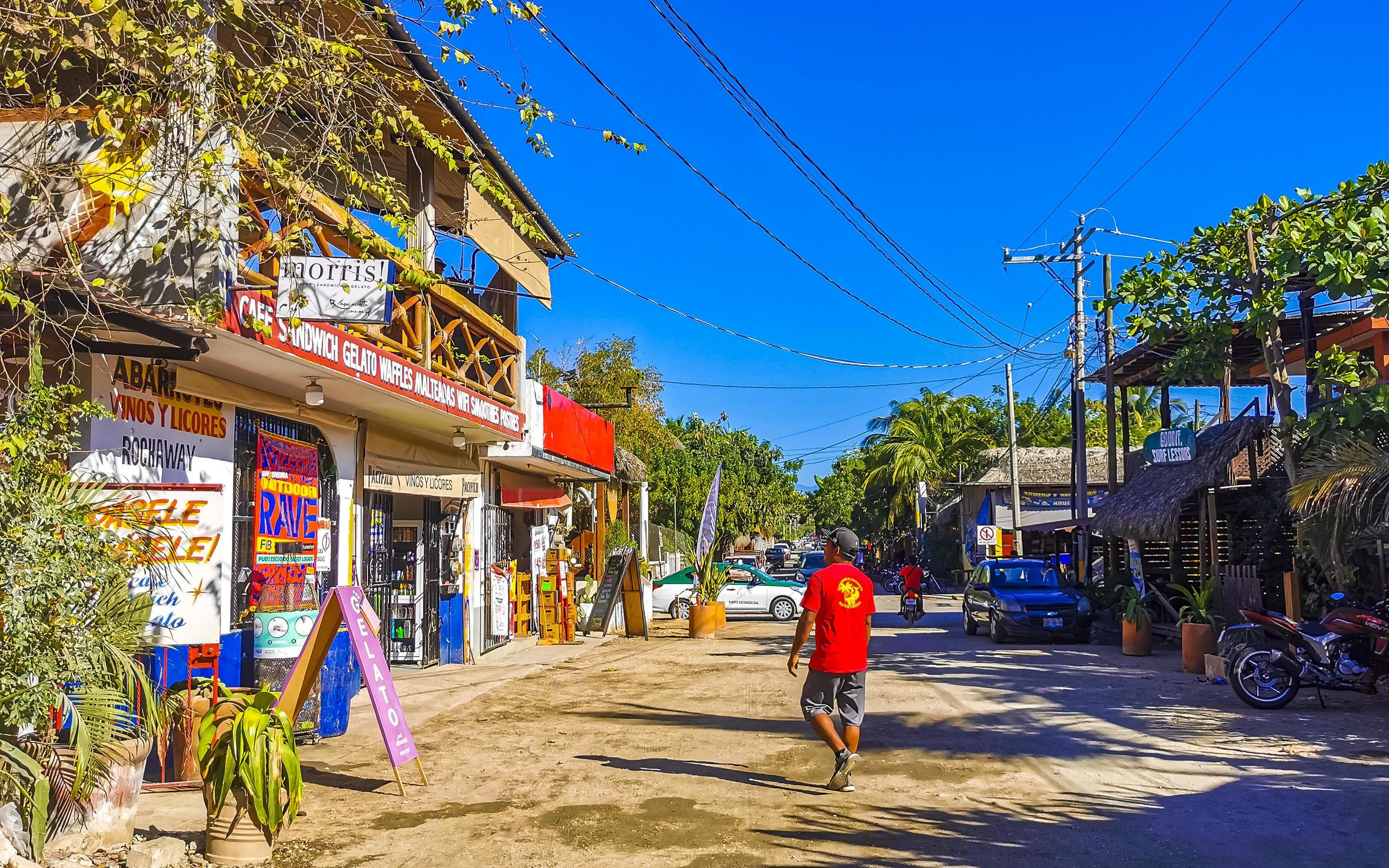 Puerto Escondido Oaxaca 2023 Colorful tourist street people stores restaurants bar La Punta