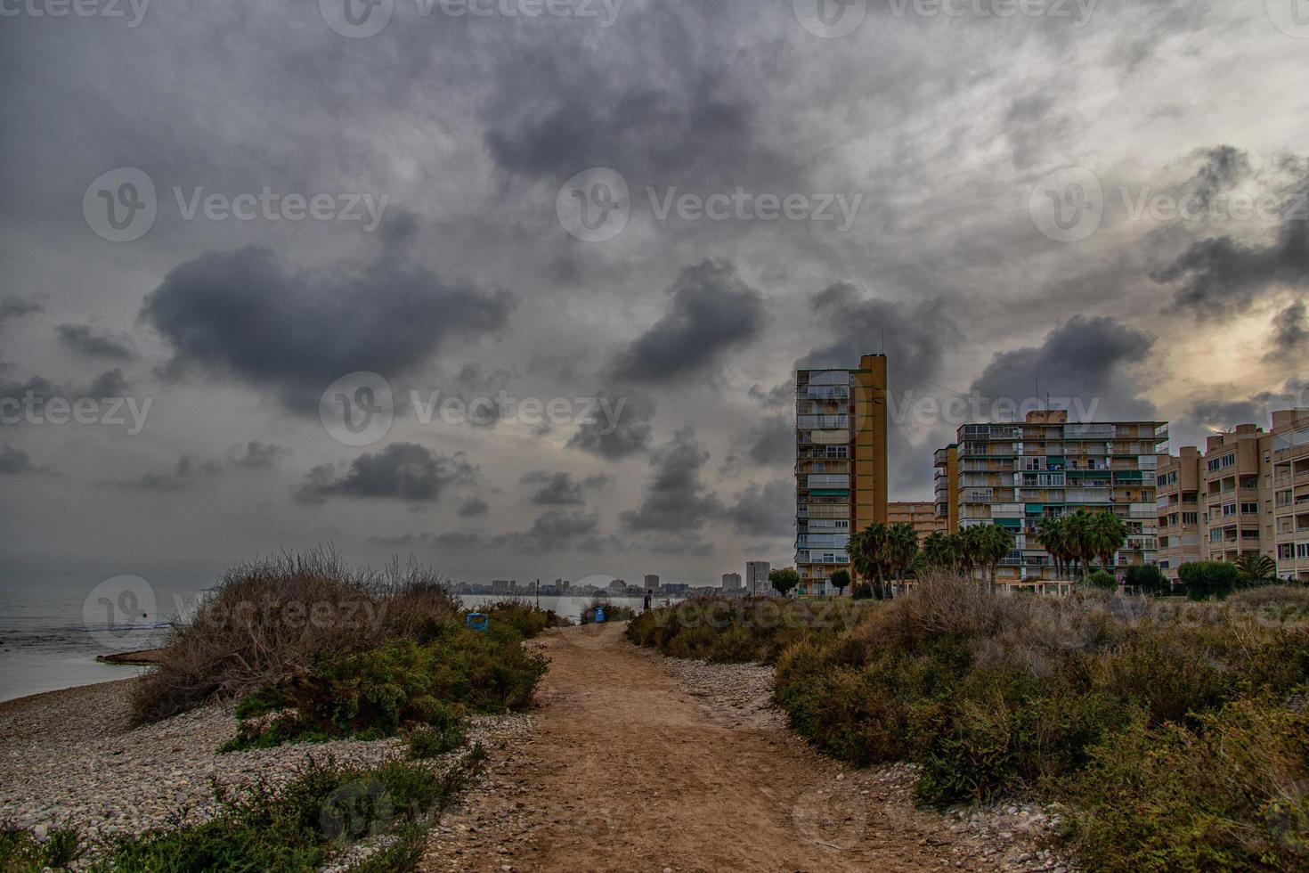 seaside landscape with sunset Alicante Spain with clouds in the sky photo