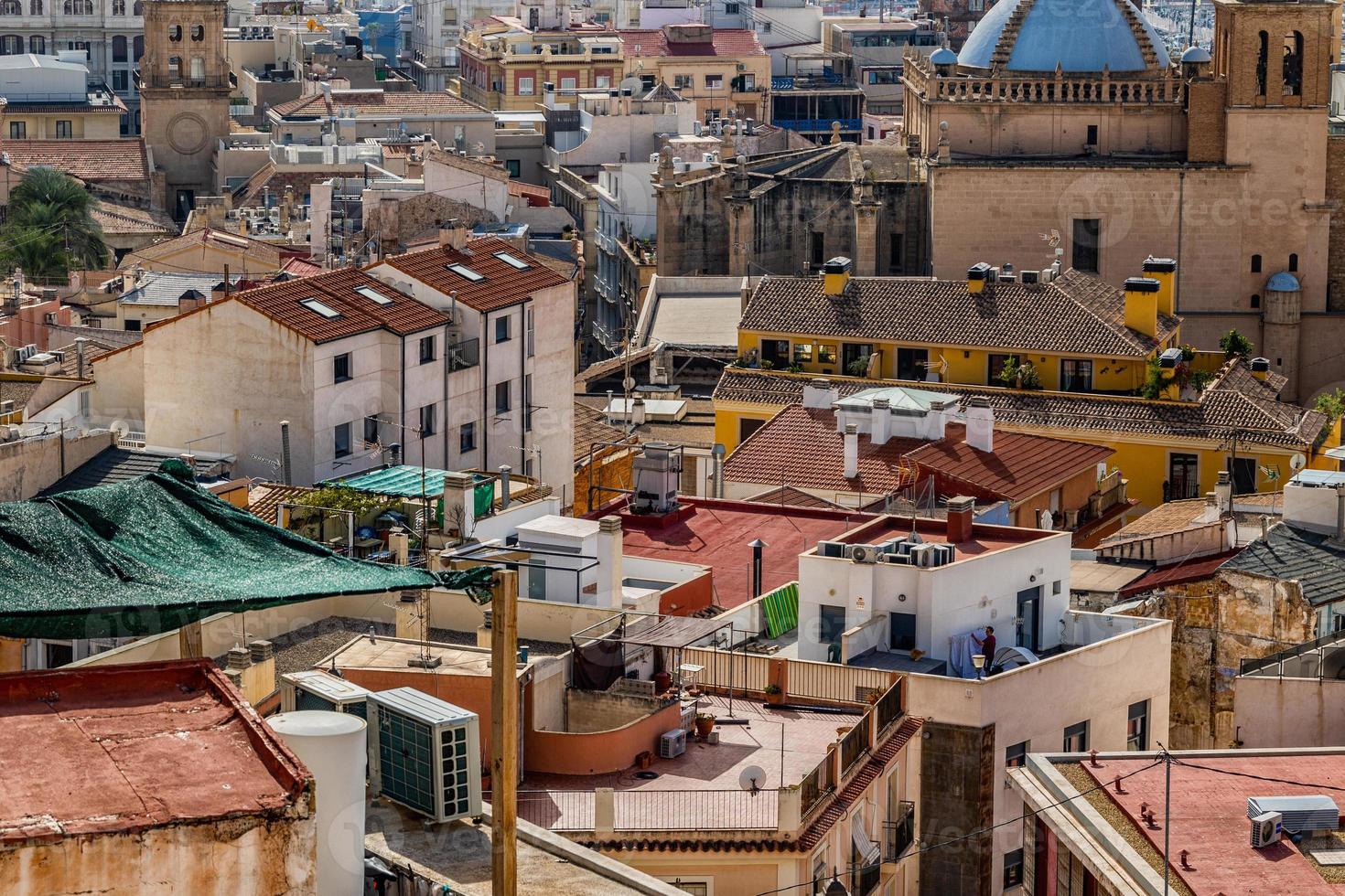 view on a sunny day of the city and colorful buildings from the viewpoint Alicante Spain photo