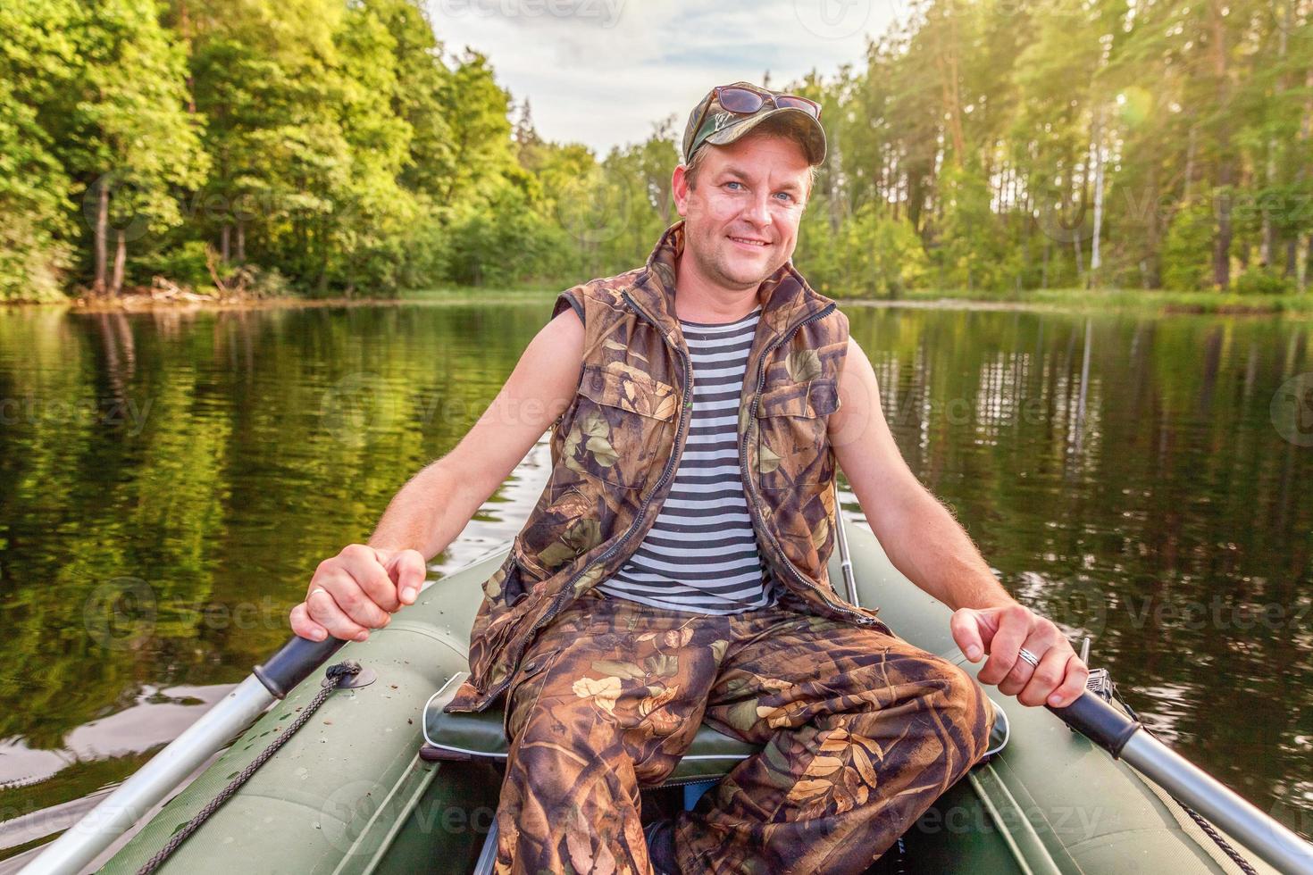 Fisherman in a boat photo