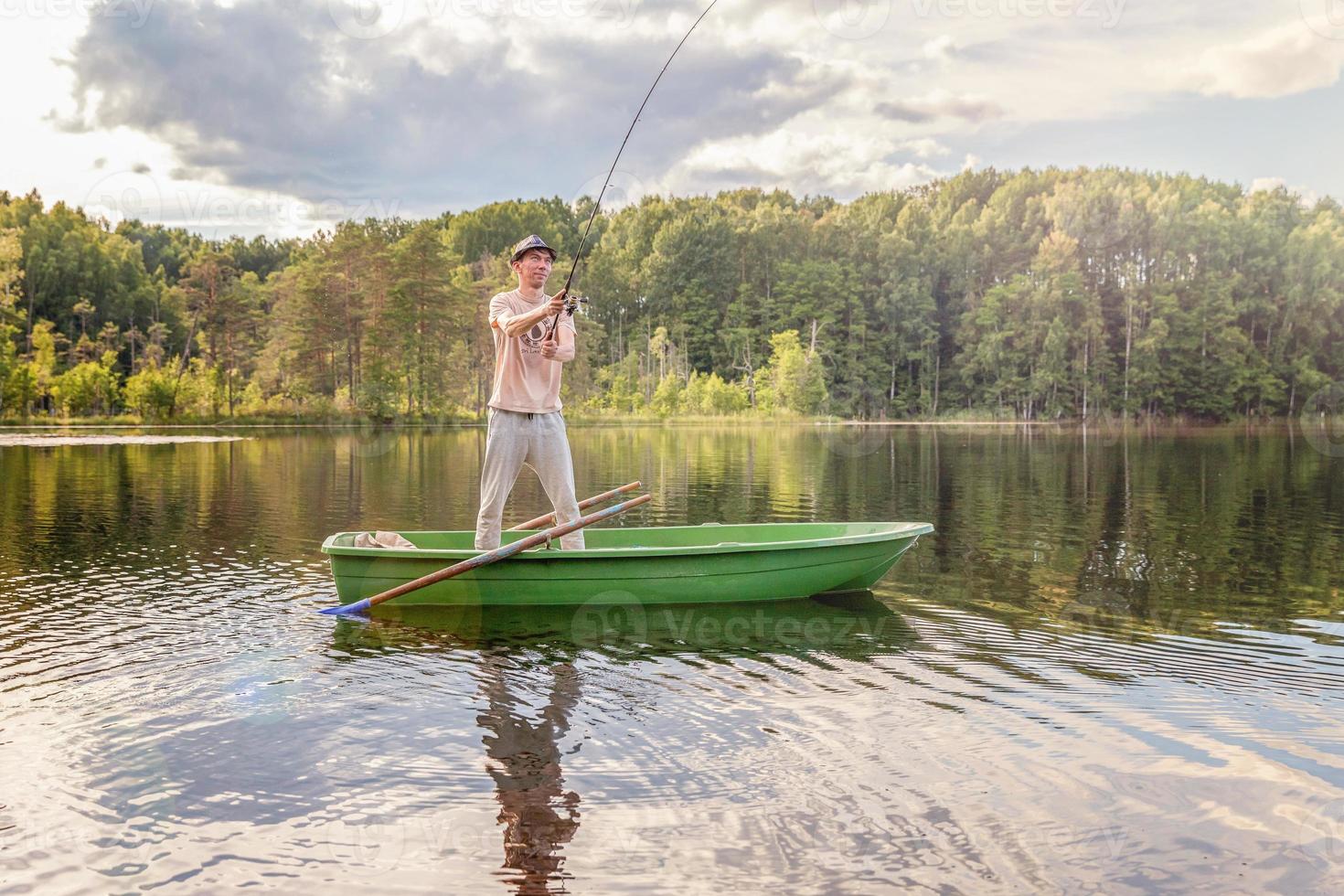 Fisherman in a boat photo