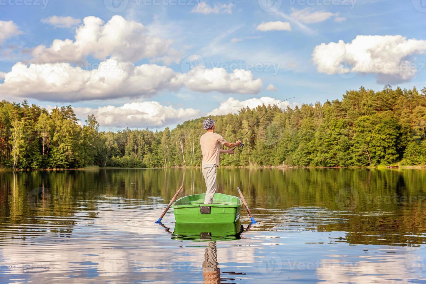 Fisherman in a boat photo