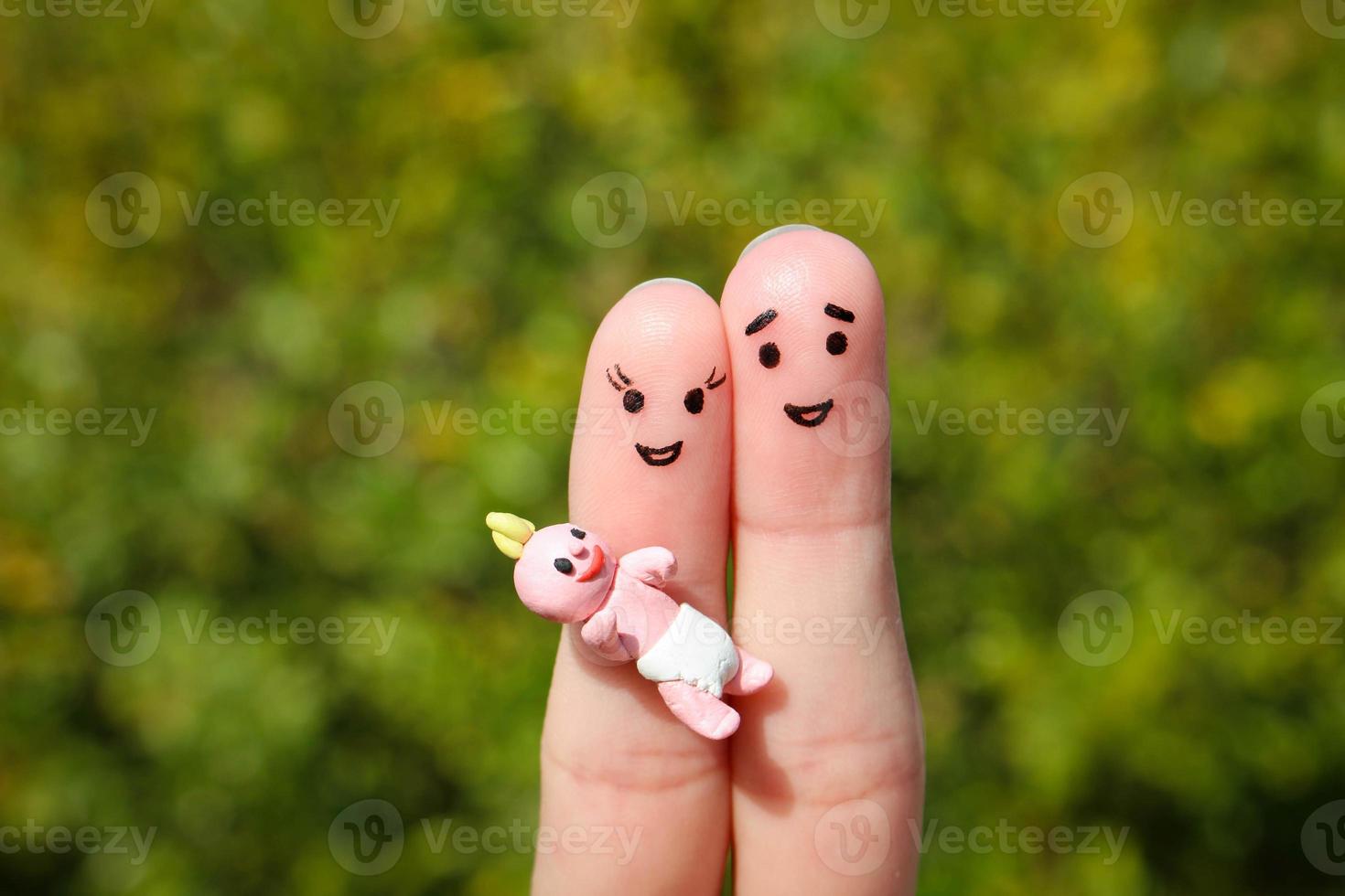 Finger art of Happy couple. Happy family holding small child photo