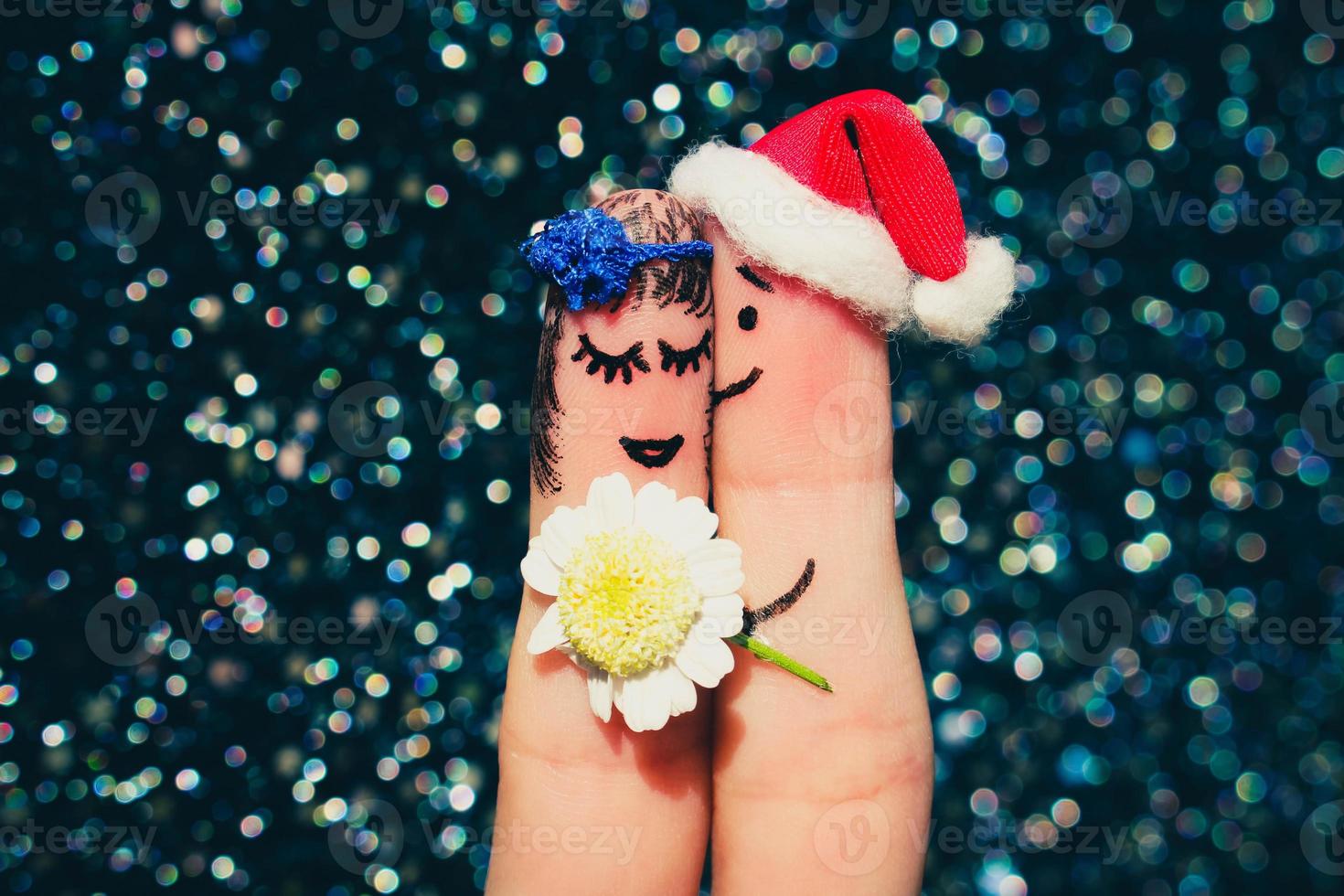 Finger art of Happy couple. Man is giving flowers to woman photo