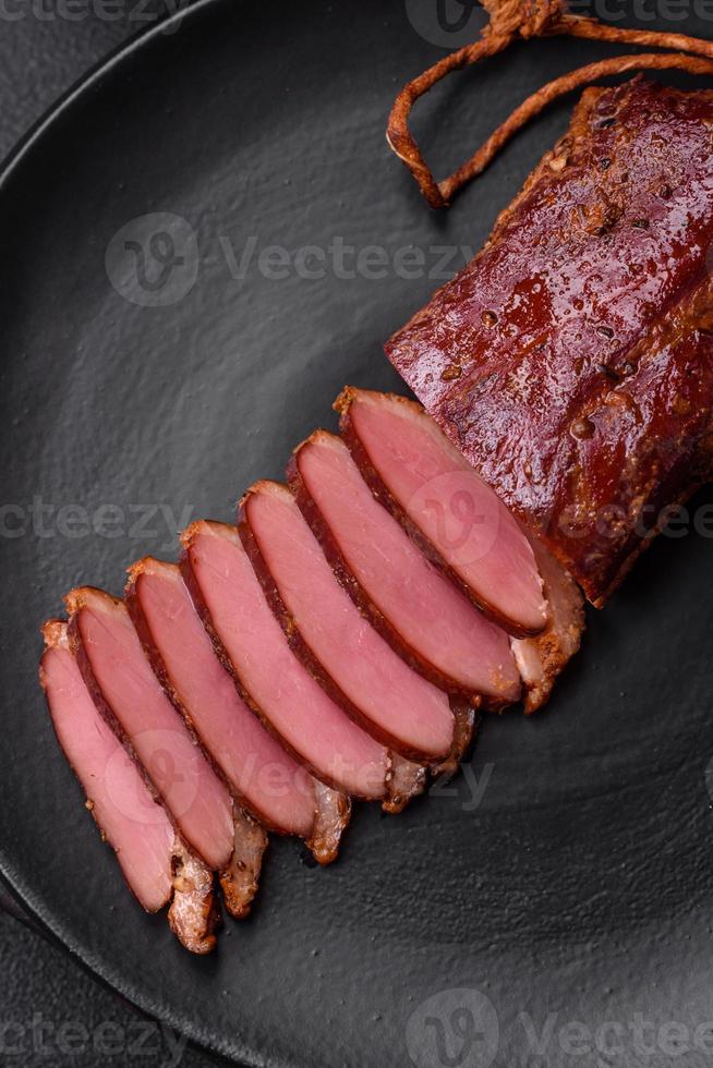 Delicious duck fillet or breast grilled or smoked with spices and salt photo